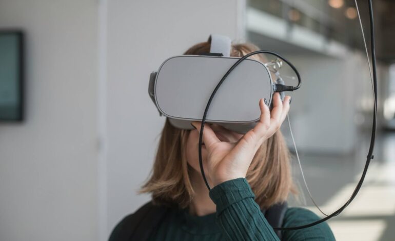 A woman wearing a virtual reality headset, fully engaged in interactive experiences that showcase the potential of VR technology.